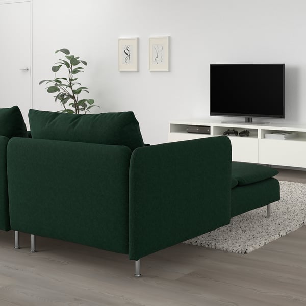 Modern living room with SÖDERHAMN dark green sofa, tv, plant, and minimalist art.