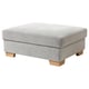 A grey SÖRVALLEN footstool with wooden legs and storage.