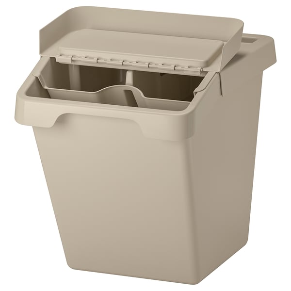 A beige SORTERA recycling bin with a foldable lid and removable insert. Made of recycled plastic with a square shape and beanshaped lid.
