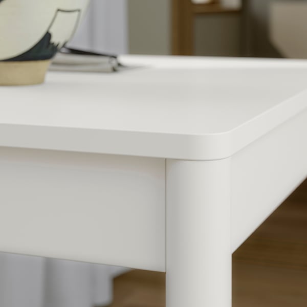 Close-up of TONSTAD table, showcasing smooth matte finish and sturdy construction.