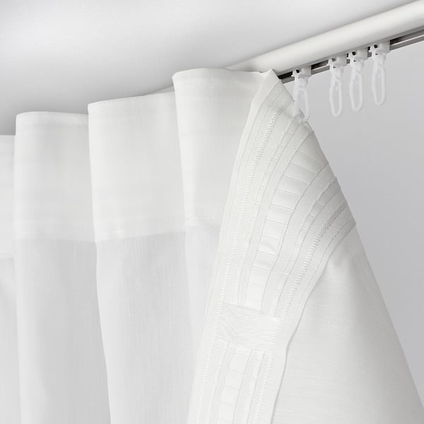 White shower curtain with hooks.