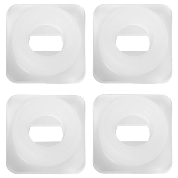 Four white square TRÖSTA polyethylene plastic coasters with a circular indentation in the centre, arranged neatly in a 2x2 grid.