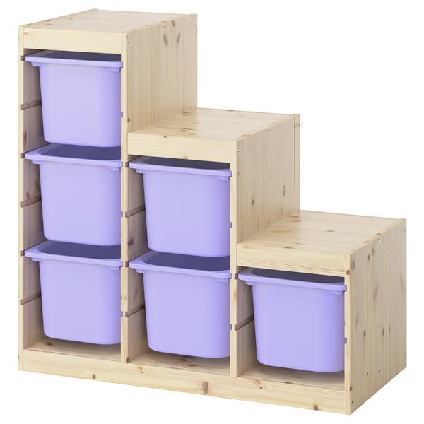 A wooden TROFAST storage unit with light purple bins, designed for kids to organise toys.