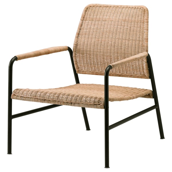 An ULRIKSBERG chair in natural colour, made from woven rattan and black metal, with a comfortable, rounded shape and sleek design.