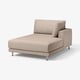 Modern beige sofa with chrome legs, minimalist design.