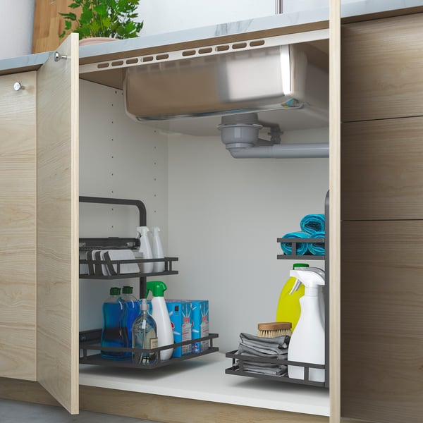 Under-sink organiser with two adjustable trays stores cleaning supplies neatly and efficiently.