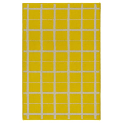 Bright yellow chequered rug with white lines, square shape, soft texture.