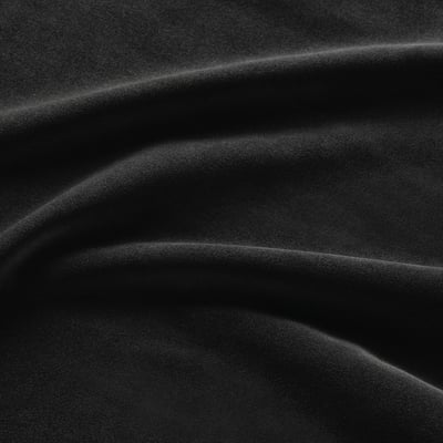 Soft, luxurious black velvet upholstery with smooth pile and subtle sheen.