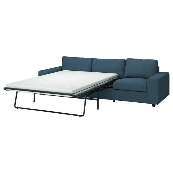 Blue VIMLE sofa-bed, modern design. Converts with thick mattress. Plywood, foam, polyester.