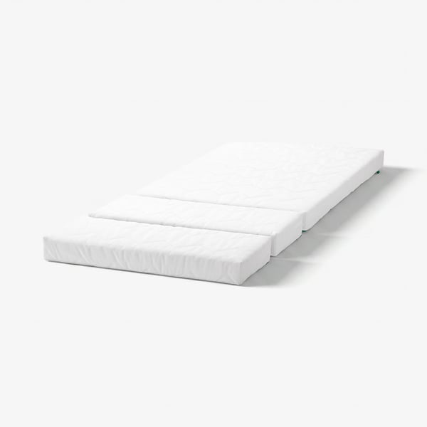 A white, three-part, reversible mattress named VIMSIG. It has different comfort levels and is designed for an extendable bed, suitable for children.