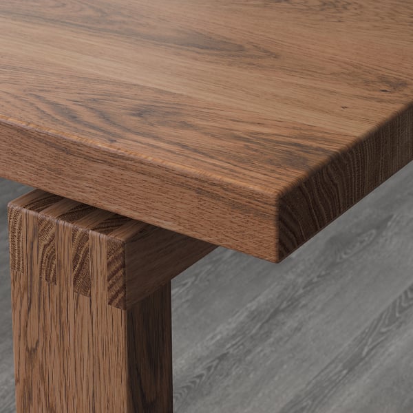 MÖRBYLÅNGA Table, plaqué chêne teinté brun, 140x85 cm