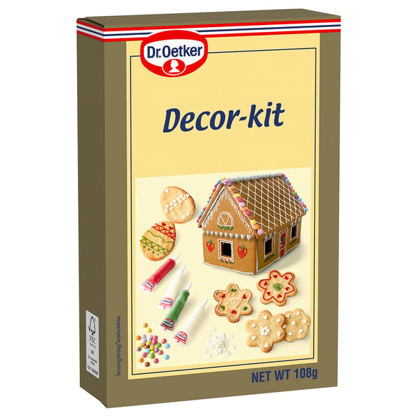 Krabice dr. Oetker dekorace, potravinová sada na zdobení pečiva, zobrazená s polevou a sušenkami.