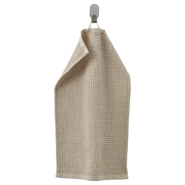 IKEA ručník jménem GULLDYNA, béžový, obdélníkový, zavěšený na háčku, texturovaný.