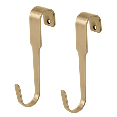 Kovové nástěnné háčky zlaté barvy, jednoduchý design, slouží k zavěšení předmětů.