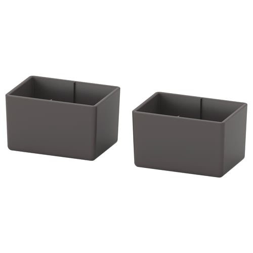 Dva šedé plastové koše čtvercového tvaru, čisté a prázdné, jednoduchý design.