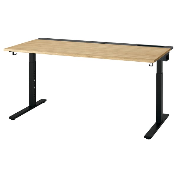 Výškově nastavitelný psací stůl MITTZON ve světlém dubu s černým rámem, elegantní obdélníkový design s vedením kabelů.