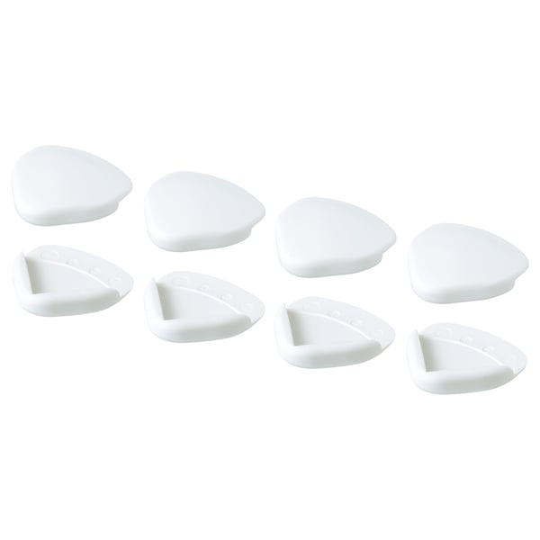 Osm bílých trojúhelníkových rohových nárazníků UNDVIKA, některé dělené, úhledně uspořádaných.