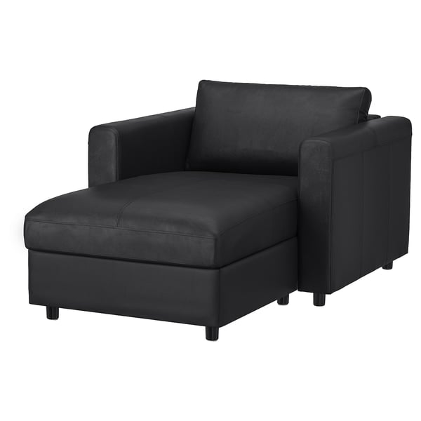 Moderní černá sekční pohovka ve tvaru L s úložným prostorem a elegantním designem.