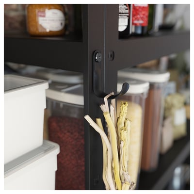 Black BROR storage hooks hold white onions in a kitchen, showcasing organisers sleek design.