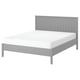 A GULLABERG bed in light grey with a wooden headboard and footboard. It has a clean, traditional design and white mattress.