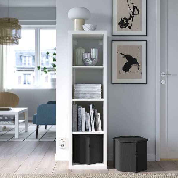 Modern living room with KJUGE storage, art, and seating.