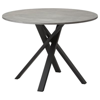 Modern round dining table with grey concrete top and black metal criss-cross legs.