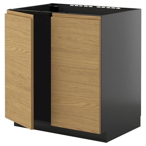 Modern kitchen cabinet with wooden door panels and black frame.