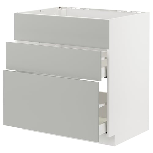 A white METOD kitchen cabinet with three grey drawers. The cabinet is rectangular and modern, featuring light grey havstorp drawer fronts.