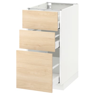 An open white cabinet with three wooden drawers, each slightly pulled out.