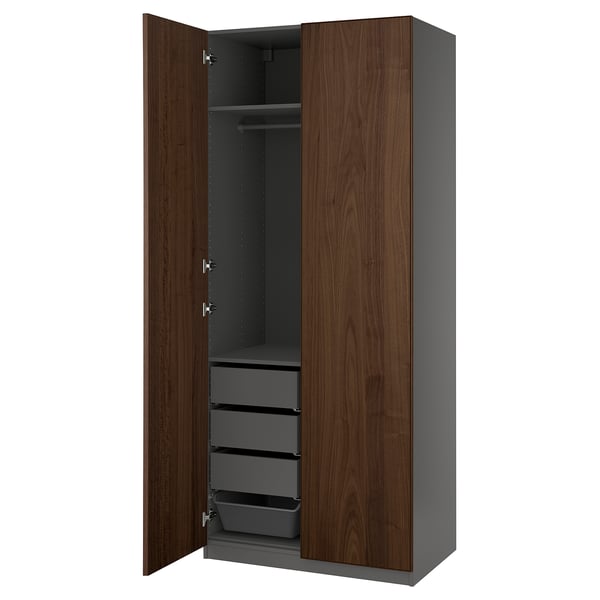 An open PAX wardrobe in dark brown, featuring shelves and drawers.