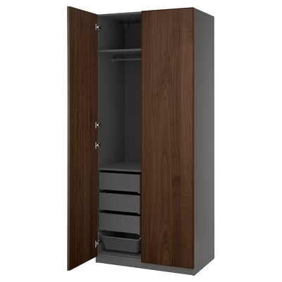 An open PAX wardrobe in dark brown, featuring shelves and drawers.