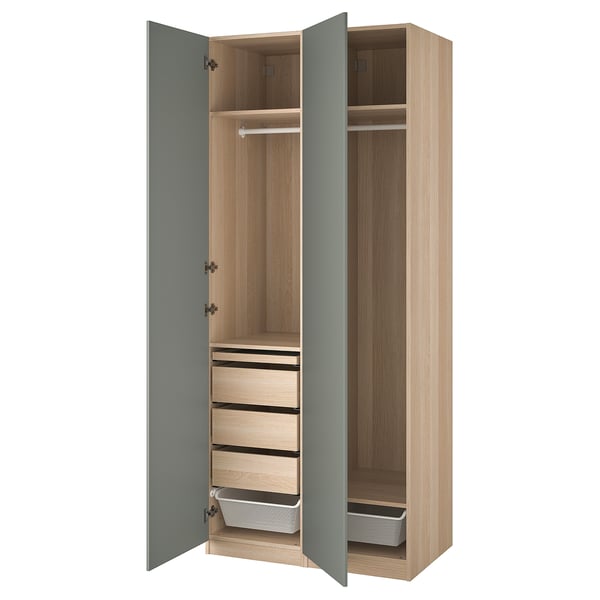 PAX wardrobe, light wood tone, blue doors open, three drawers, shelves, and hanging rod.
