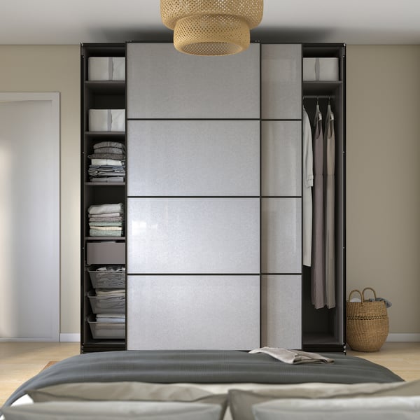 Modern wardrobe with sliding doors and shelves for clothes and toys. Soft-close mechanism; wall-mountable.