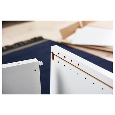 White PLATSA storage unit, minimalist and modular. Rectangular shape with a sleek, modern design, made from recycled materials.