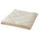 Natural beige duvet folded, RÅDHUSVIN brand, made of cotton and wool, square shape with diamond pattern stitching.