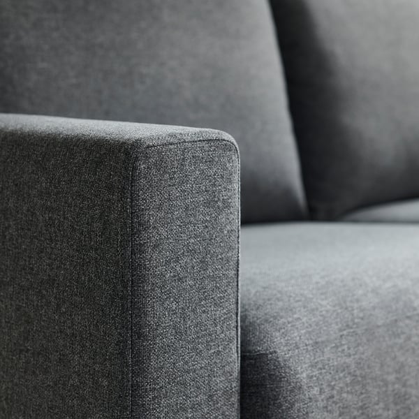 Close-up of modern sofa showing soft, supportive cushions with textured fabric. Comfortable and durable, designed for easy cleaning.