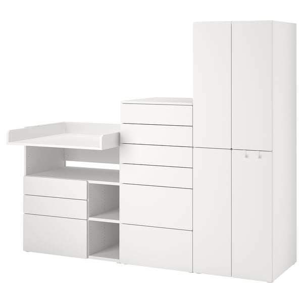 White SMÅSTAD baby unit with safe edges, shelves, drawers, and convertible changing table/desk.