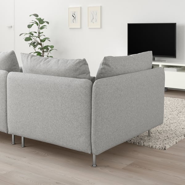 Modern living room with light grey SÖDERHAMN sectional, tv, plant, and rug.