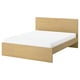 Minimalist light wood bed with white mattress, simple design, sturdy.