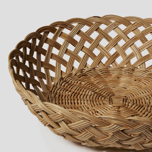 Handwoven rattan basket, large & sturdy, intricate lattice design, natural finish, ideal for bread or fruit, showcasing quality craftsmanship.