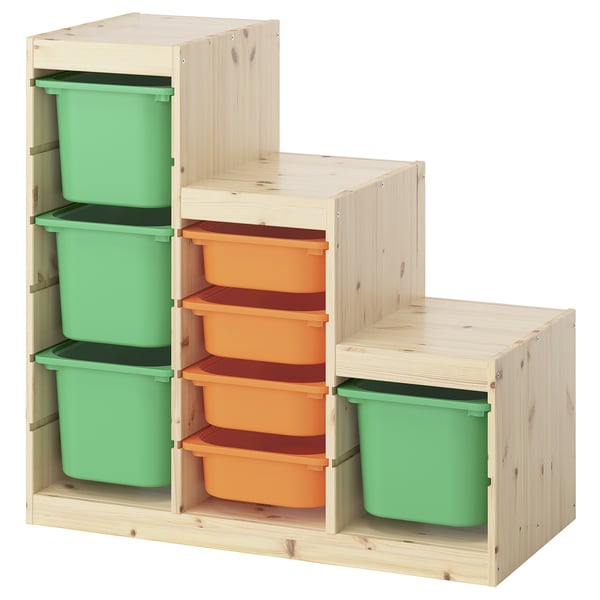 This image shows an ikea TROFAST storage unit with green and orange plastic bins in a wooden frame.