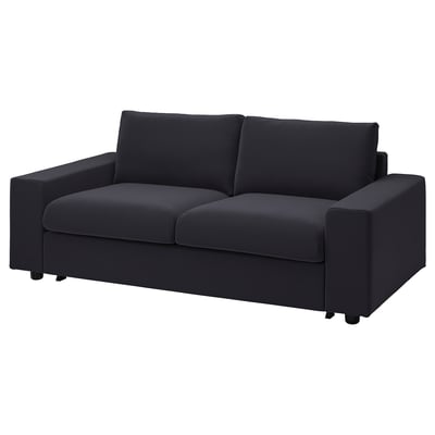Modern black sofa-bed, minimalist design, velvet fabric, comfortable cushions.