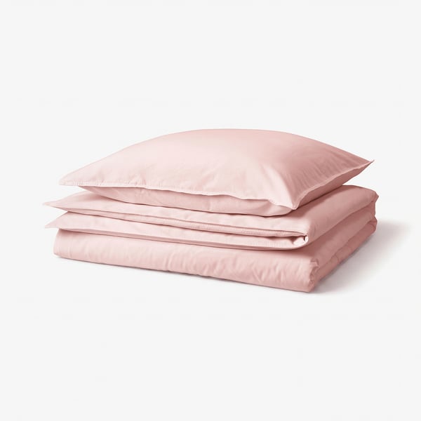 Folded pink recycled cotton duvet cover & pillowcases stack.
