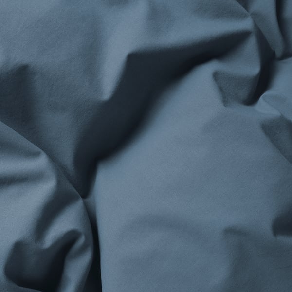 Dark blue fabric, smooth texture, pleated detail, high quality.