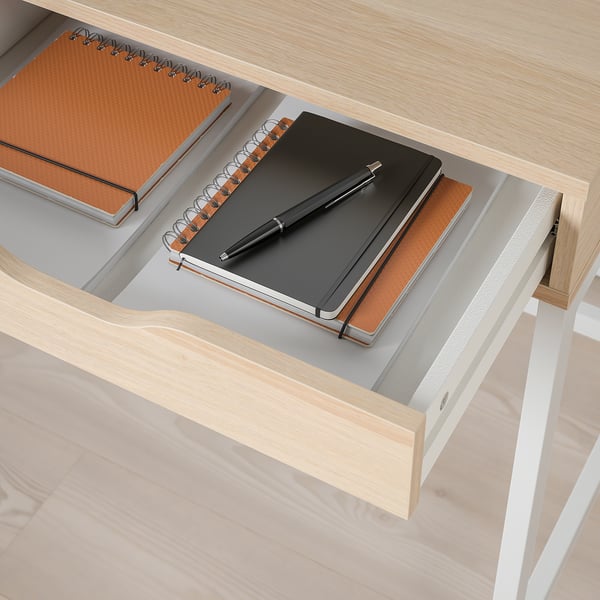 Drawer with notebook and pen
