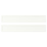 Two white rectangular shelves with plastic edging and foil.