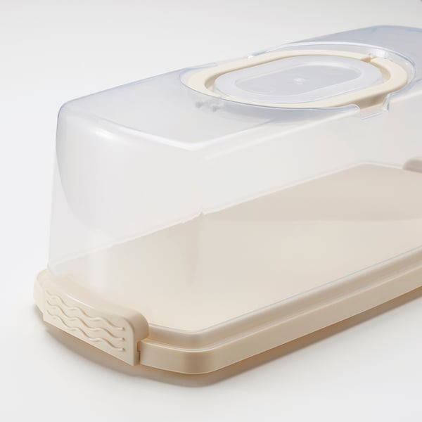 Clear plastic cake container with secure lid and carry handle, ideal for storing and transporting cakes.