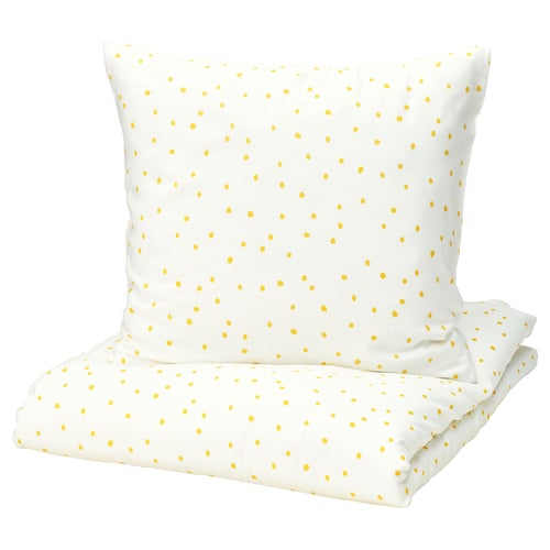 A white BARNDRÖM bedding set with yellow polka dots, featuring a pillowcase and sheet.