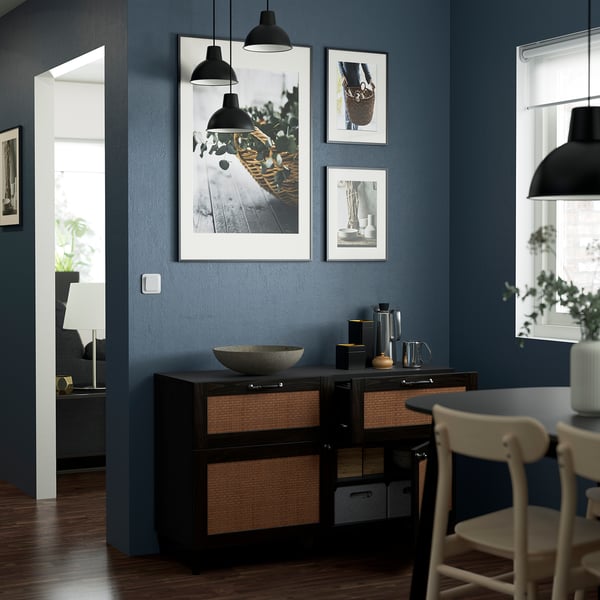 Modern dining room with BESTÅ sideboard, pendant lamps, and gallery wall.
