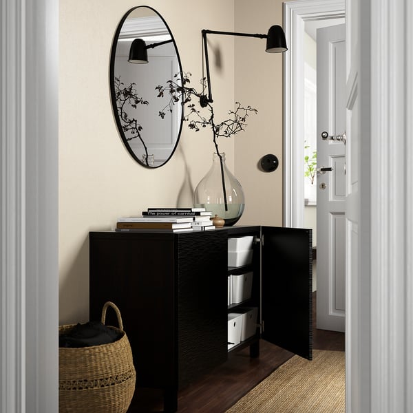 Modern entrantway with BESTÅ sideboard for storage. It has adjustable shelves, push-open and soft-close doors, with knobs sold separately.